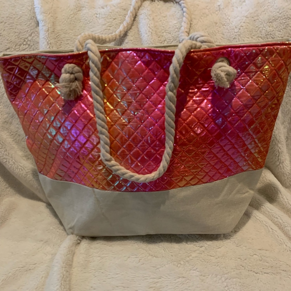 Cute orange/pink iridescent beach tote with rope handles.